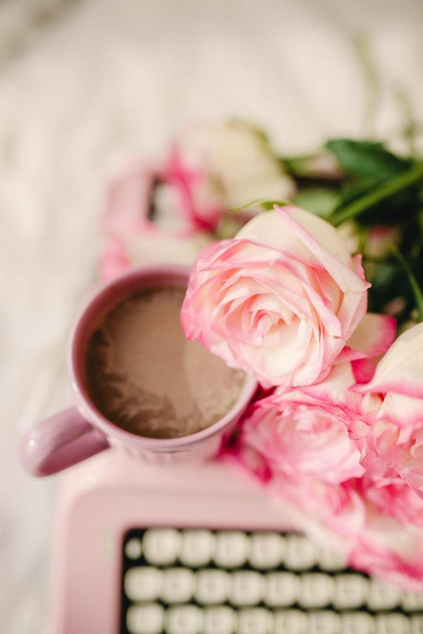 arrangement with roses and coffee cup