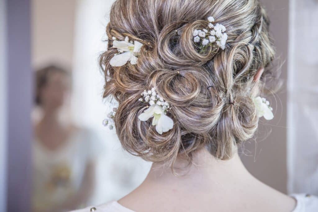 woman wearing white floral hair vine