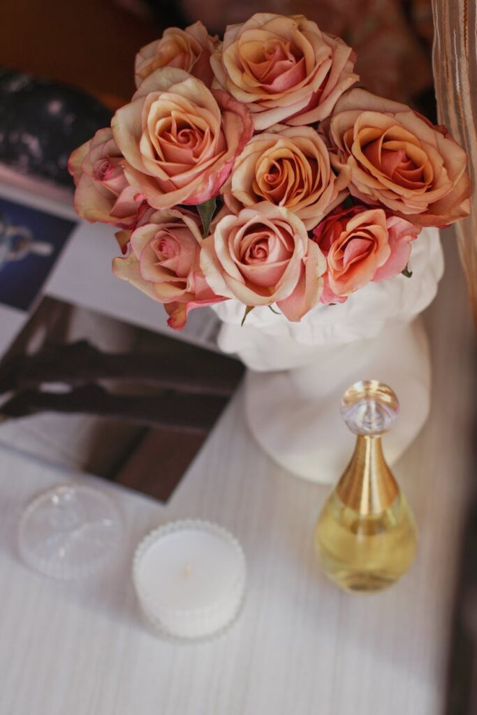 tea roses in vase on table