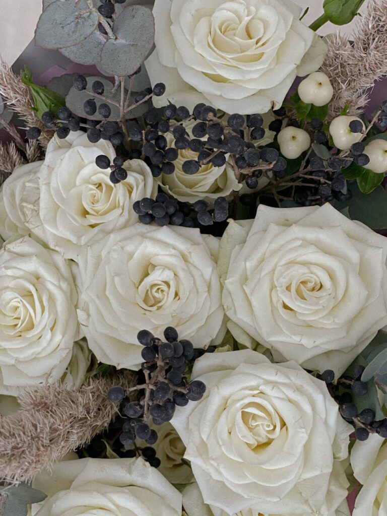 close up of a bouquet with white roses