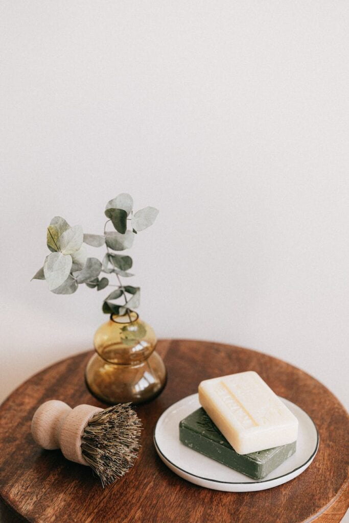 bamboo shaving swab and soaps on wooden table