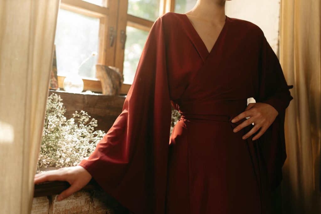 woman wearing kimono by the window