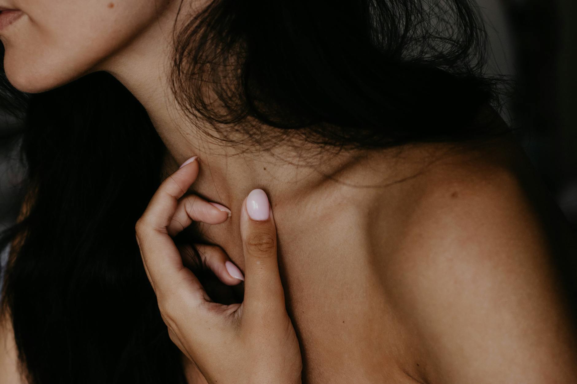 woman wearing pink manicure