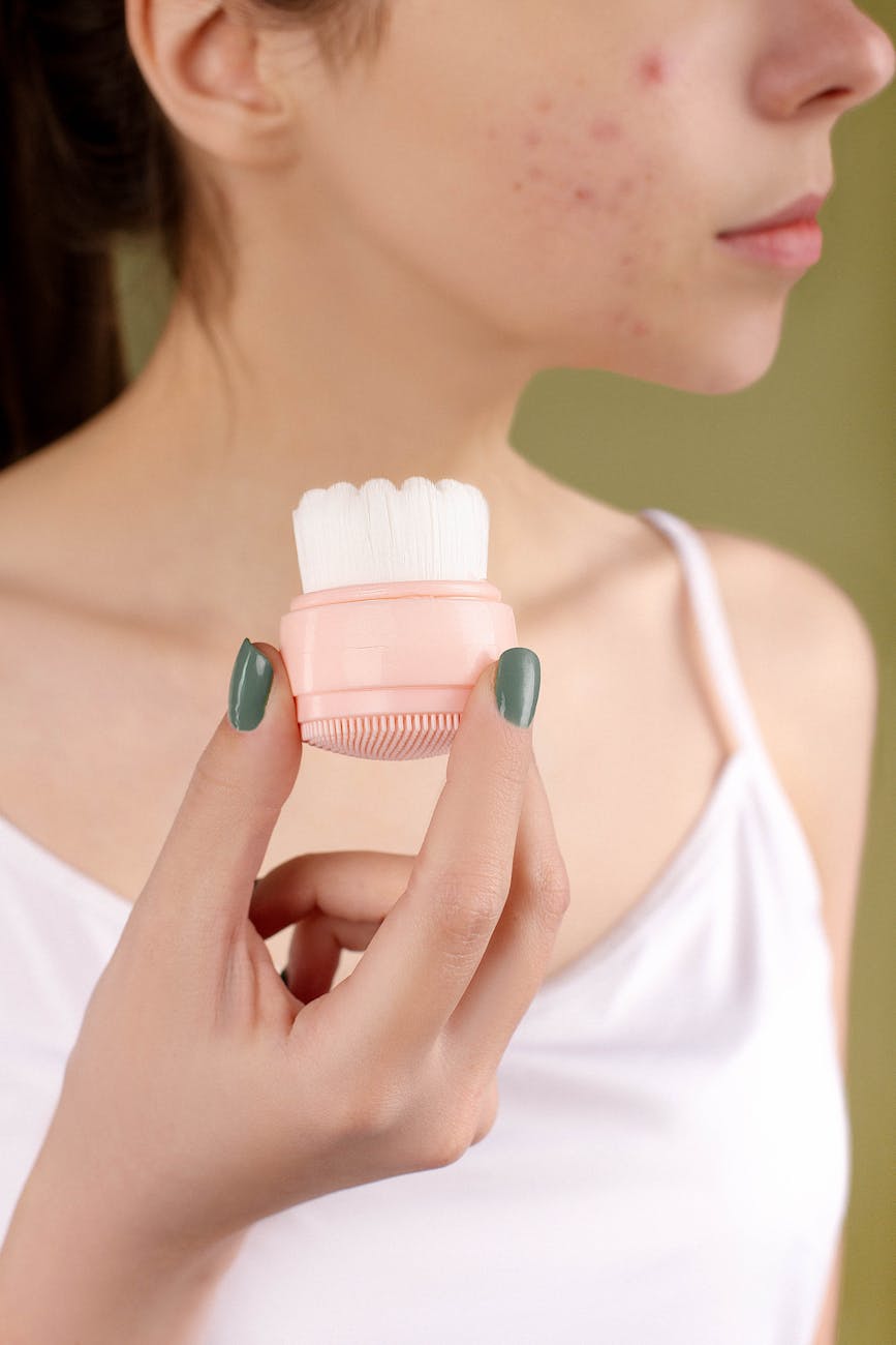 woman holding a cleansing brush